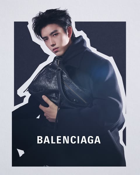 This ad features a person wearing a black outfit with a Balenciaga bag. The ad's focus is on showcasing the brand an