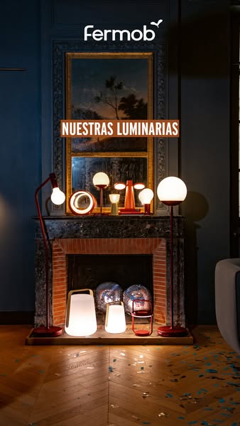 This image ad showcases a collection of Fermob lighting products arranged in a stylish interior setting. The ad emphasiz