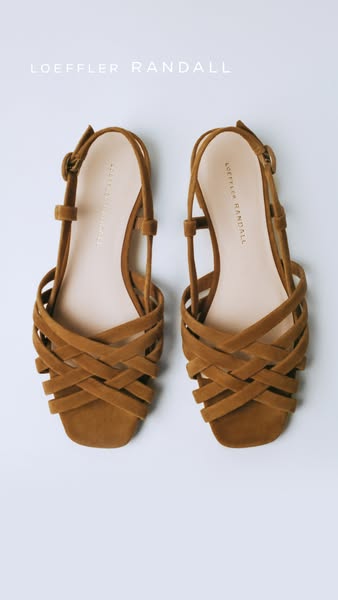 This ad showcases a pair of Loeffler Randall sandals on a solid background.