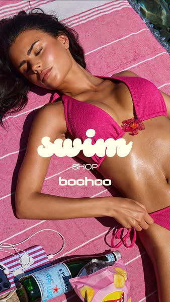 This ad features a model on a striped towel, highlighting swimwear. Text overlay directs viewers to shop at boohoo.
