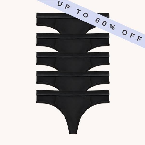 This ad features a stack of black thong underwear with a diagonal banner stating "UP TO 60% OFF."