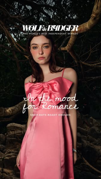 This ad from Wolf & Badger features a woman wearing a pink dress and encourages viewers to 'Shop date-ready dres