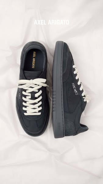 This ad features a pair of Axel Arigato sneakers on a white background. The ad showcases the design and style of the sne