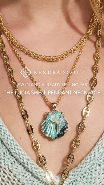 An ad showcasing the Lucia Shell Pendant Necklace from Kendra Scott.