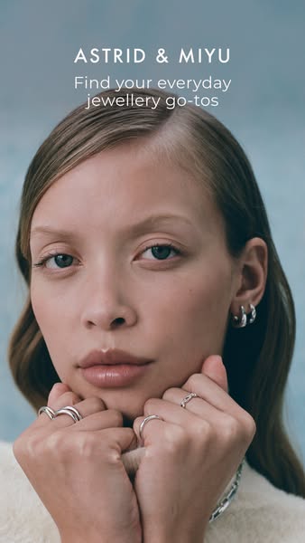 This ad showcases a brand of jewelry, highlighting their range of everyday jewelry pieces with a close-up shot of a woma