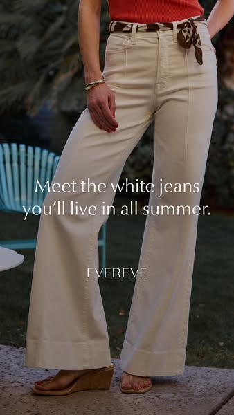 An ad featuring a woman wearing EverEve white jeans with a scarf as a belt, shot outdoors.