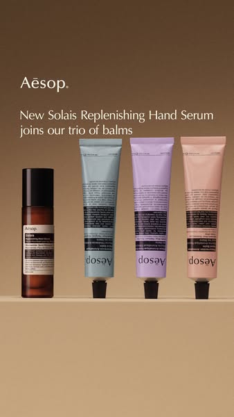 This image ad features an array of the brand's products, highlighting a new addition to their hand balm collection a