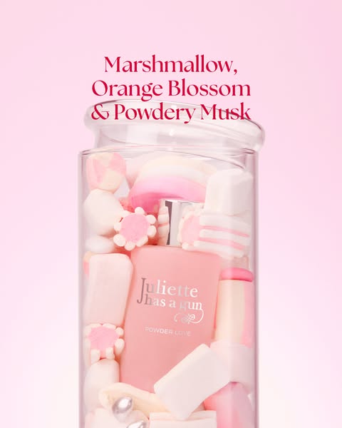 This ad showcases Juliette has a Gun's Powder Love perfume. The perfume bottle is displayed inside a clear jar fille