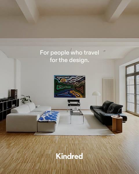 The ad showcases a modern, well-lit living space and targets people who travel for the design, hinting that the brand, K