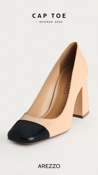 This ad features a single high heel shoe in a neutral color with a black toe. The ad also shows the brand name. 