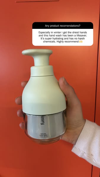 The ad features a hand holding a bottle of Fussy hand wash, with a caption above that features a testimonial about the p