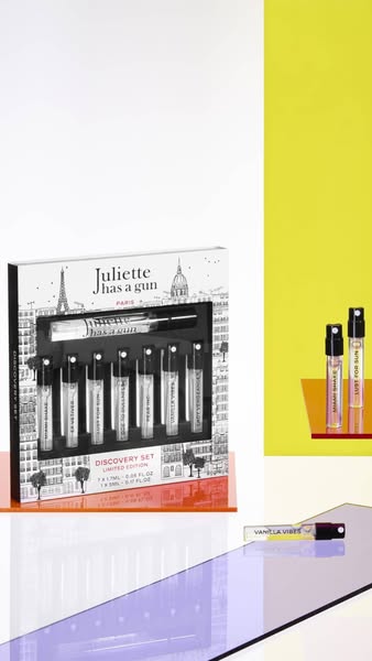 This ad showcases the Juliette has a Gun Discovery Set, featuring multiple perfume samples in a decorative box. The ad u