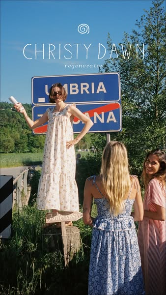 This ad features three women in Christy Dawn dresses in a sunny, outdoor setting. The ad highlights the brand's aest