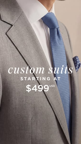 This is an image ad for custom suits. The ad features a partial view of a grey suit jacket, a white shirt, and a blue ti