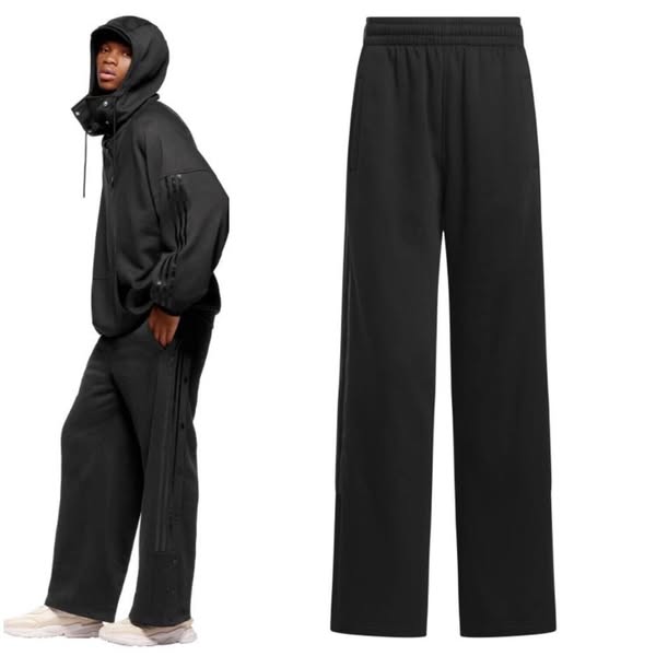 This ad features a person wearing a black Adidas hooded jacket and black Adidas pants. The ad also shows a pair of black