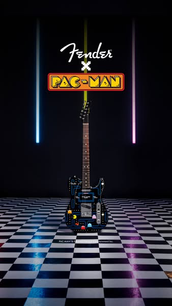 A Fender electric guitar is featured as part of a collaboration with the brand Pac-Man, which is shown with a neon sign 