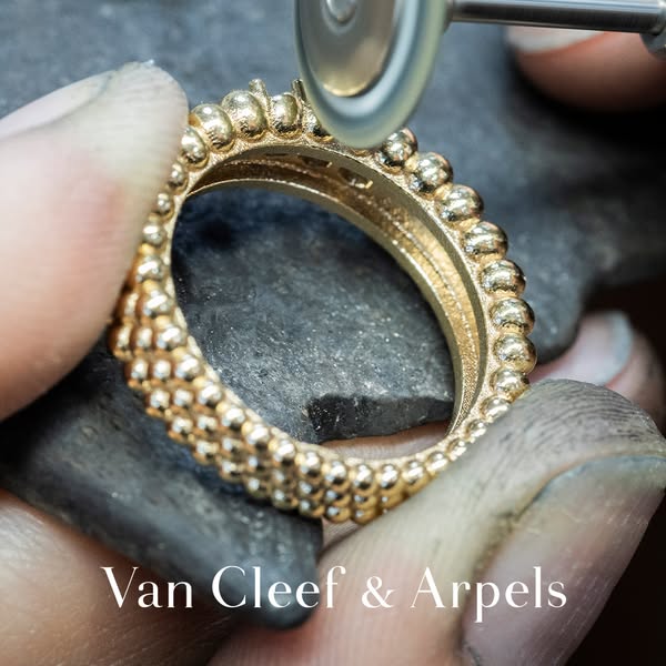 This image ad showcases the Van Cleef & Arpels Perlée collection ring being finely polished during the production pr