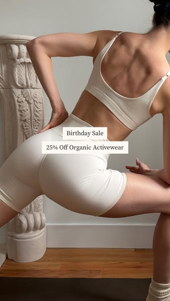 The ad features a woman wearing activewear along with a text overlay promoting a sale.