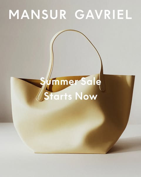 This ad by Mansur Gavriel shows a single cream-colored handbag against a neutral background. It promotes the brand's