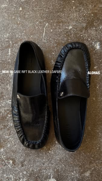 This ad announces the new Alohas Gabe Rift Black Leather Loafers. It is a simple image of the shoes with the brand name 