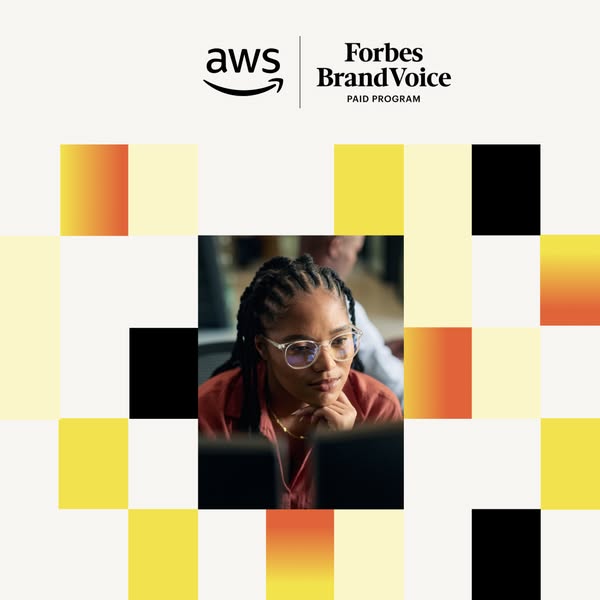This ad features a young Black woman working at a computer. The ad promotes AWS and Forbes BrandVoice.