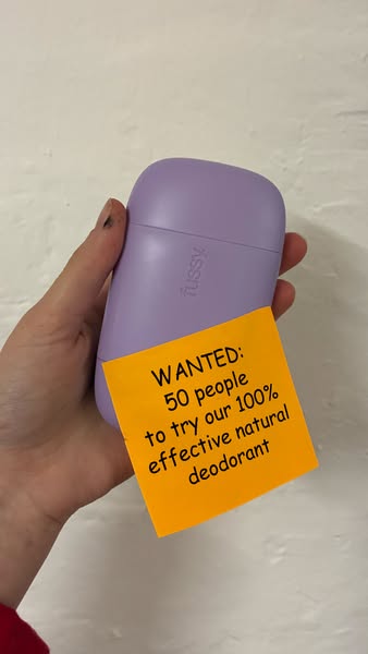 This ad features a hand holding a Fussy brand deodorant container with a sticky note attached that says "WANTED: 50