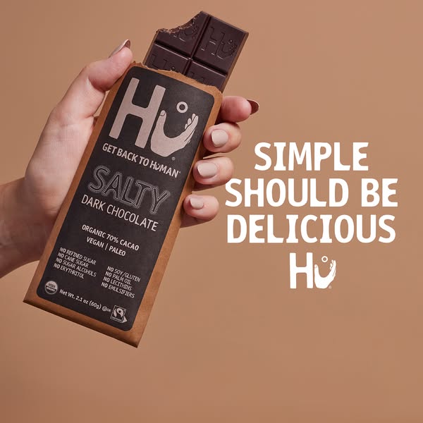 This ad for Hu chocolate features a single bar of their Salty Dark Chocolate bar with the tagline 'Simple Should Be 