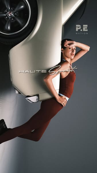 This ad features a woman in workout clothes leaning against the fender of a cream-colored classic car. The ad uses the p