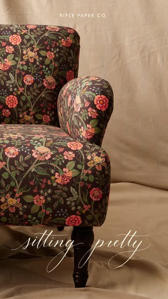 This ad showcases a floral patterned chair from Rifle Paper Co.