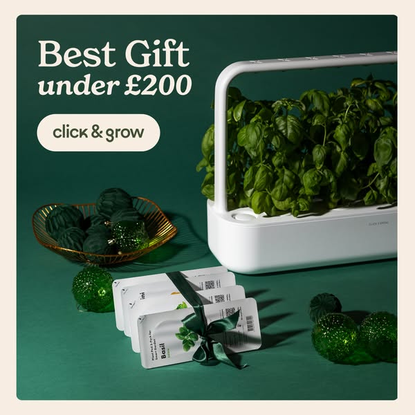 This ad showcases the Click & Grow indoor gardening system as a gift option under £200. It features the product with