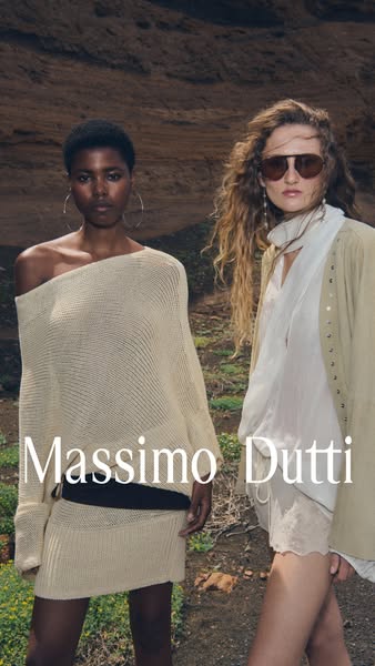 An image ad featuring two models in a rugged outdoor setting, wearing apparel from Massimo Dutti. The ad focuses on show