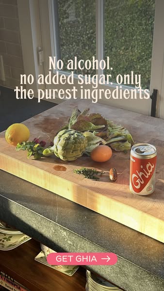 This image ad for Ghia features a can of the product next to ingredients like artichokes and lemon, suggesting the purit