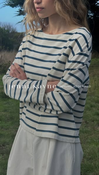 This ad for Jenni Kayne features a model wearing the brand's striped shirt and advertises their Spring collection.