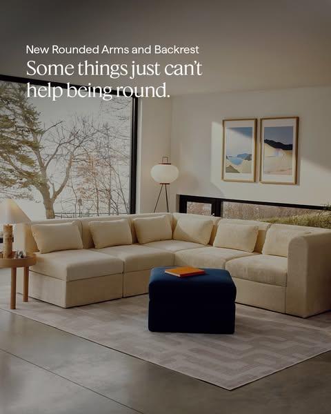 The image ad showcases a sectional couch with rounded arms and backrest. It emphasizes a modern and soft aesthetic.
