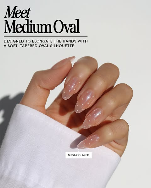 This ad showcases the brand's medium oval nail shape and sugar glazed color.