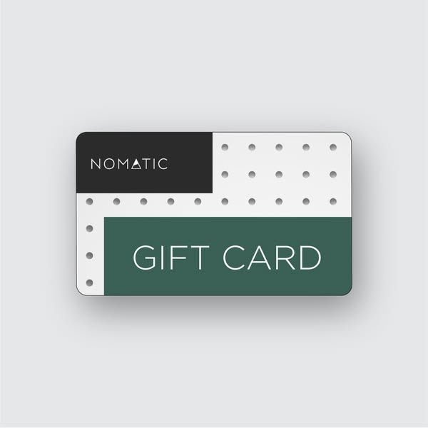 This ad promotes Nomatic gift cards. The ad features a Nomatic gift card on a gray background.