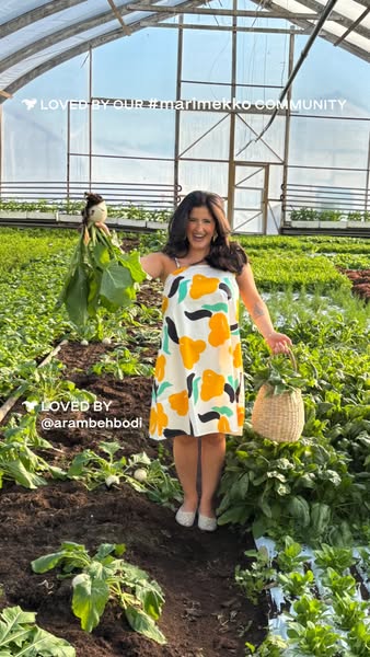 This image ad features a woman in a dress standing in a greenhouse. She is holding a basket and a plant and the ad utili