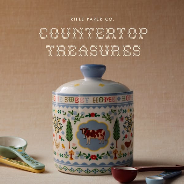 This ad features a decorative jar from Rifle Paper Co. set amidst a kitchen-themed backdrop. The jar is patterned with r