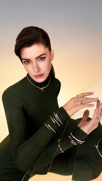 An ad featuring Anne Hathaway showcasing jewelry pieces.