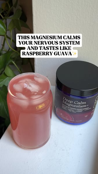 Image ad for Deep Calm Magnesium+. A glass containing a pink liquid and ice is shown next to a jar of magnesium powder, 