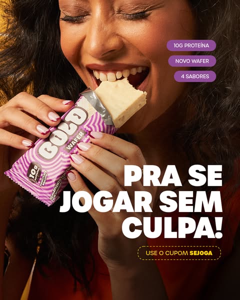 A close up image ad for BOLD wafer bar. The woman smiles with enjoyment as she bites into the bar.