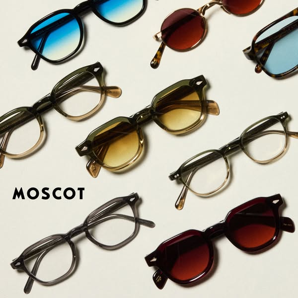 This ad showcases a collection of MOSCOT eyeglasses and sunglasses. The image is a flat lay featuring different styles a