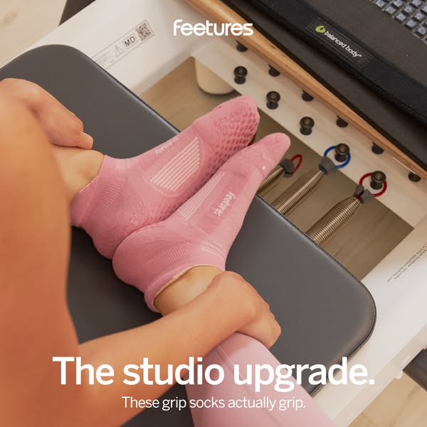 This ad showcases Feetures grip socks, emphasizing their utility in a fitness studio environment. The focus is on the so