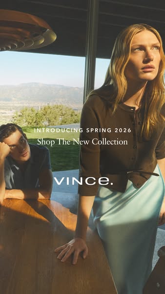 This ad showcases Vince's Spring 2026 collection featuring a woman standing next to a table with a man sitting at it