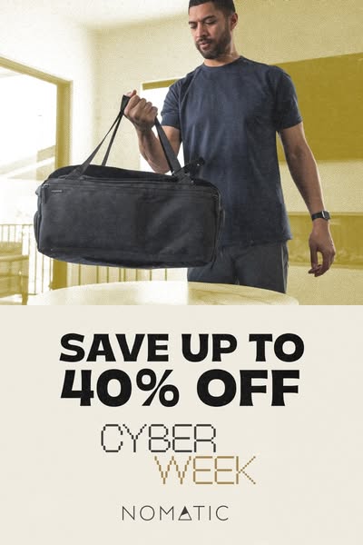 This image ad for Nomatic promotes a Cyber Week sale with savings of up to 40% off. The ad features a man holding a blac