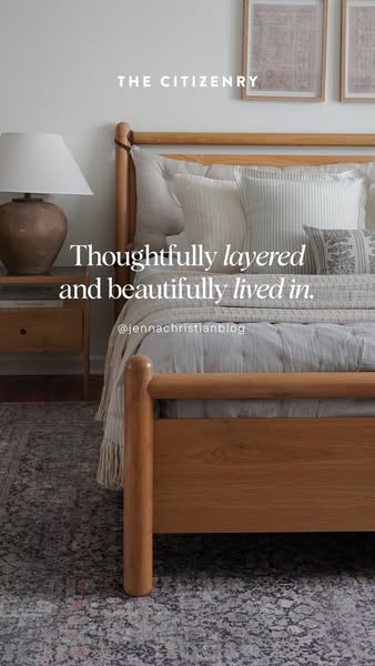An image showcasing a bedroom scene with a wooden bedframe, layered bedding, and neutral decor. The ad promotes The Citi