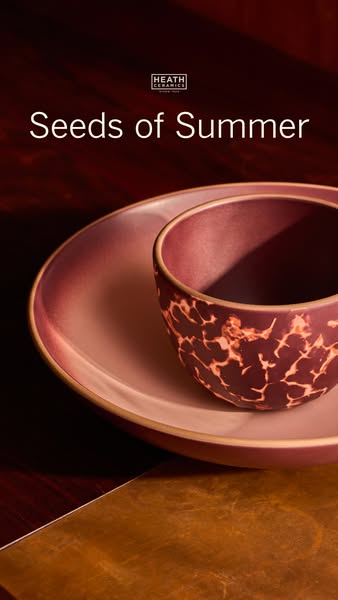 This ad features two ceramic pieces from Heath Ceramics, a bowl and a plate, in a warm, inviting setting. The ad uses a 