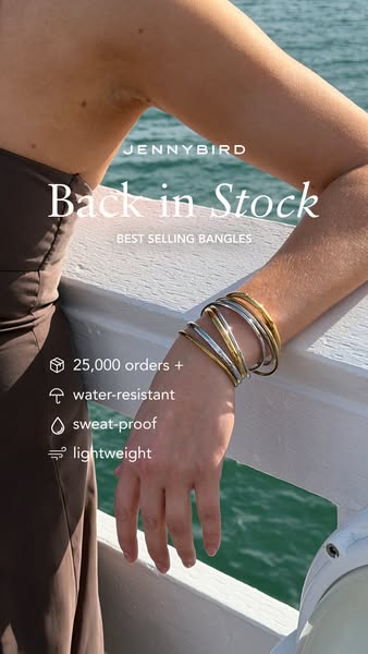 This image ad promotes Jenny Bird bangles, highlighting their return to stock and desirable features like water resistan