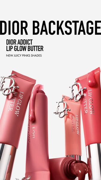 The image is a product-focused still life showcasing multiple tubes of Dior Addict Lip Glow Butter. The tubes are arrang