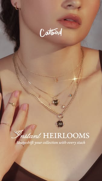 This image ad for Catbird jewelry uses a close-up shot of a model wearing multiple necklaces. The headline, "Instan